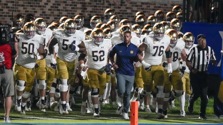 Sep 30, 2023; Durham, North Carolina, USA; Notre Dame Fighting Irish head coach Marcus Freeman leads his team onto the field during the first quarter against the Duke Blue Devils at Wallace Wade Stadium.