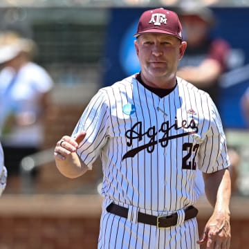 Jun 8, 2024; College Station, TX, USA; Texas A&M head coach Jim Schlossnagle greets players during introductions prior to the game against the Oregon at Olsen Field, Blue Bell Park.