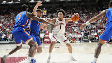 Mar 5, 2025; Tuscaloosa, AL, USA;  Florida center Rueben Chinyelu (9) and Florida guard Urban Klavzar (7) stop a drive by Alabama guard Mark Sears (1) at Coleman Coliseum. Mandatory Credit: Gary Cosby Jr./USA TODAY Network via Imagn Images