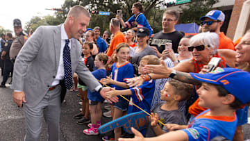Florida Gators head coach Billy Napier shakes hands with fans during Gator Walk before the start of the game against the UCF Knights at Ben Hill Griffin Stadium in Gainesville, FL on Saturday, October 5, 2024. [Doug Engle/Gainesville Sun]