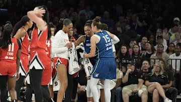 Aug 2, 2025; Las Vegas, Nevada, USA; Players from the Las Vegas Aces and Minnesota Lynx surround Lynx forward Napheesa Collier (24) after she does down with an injury in the third quarter of their game at Michelob Ultra Arena. Mandatory Credit: Candice Ward-Imagn Images