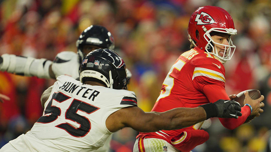 Jan 18, 2025; Kansas City, Missouri, USA; Houston Texans defensive end Danielle Hunter (55) tackles Kansas City Chiefs quarterback Patrick Mahomes (15) during the third quarter of a 2025 AFC divisional round game at GEHA Field at Arrowhead Stadium. Mandatory Credit: Jay Biggerstaff-Imagn Images