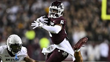 Nov 16, 2024; College Station, Texas, USA; New Mexico State Aggies safety Tayden Barnes (3) and safety Nick Session (5) tackle Texas A&M Aggies wide receiver Cyrus Allen (6) during the first half at Kyle Field. Mandatory Credit: Maria Lysaker-Imagn Images 
