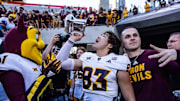 Nov 30, 2024; Tucson, Arizona, USA; Arizona State Sun Devils wide receiver Derek Eusebio (83) drinks out of the Territorial Cup at the end of the game against the Arizona Wildcats at Arizona Stadium. Mandatory Credit: Aryanna Frank-Imagn Images