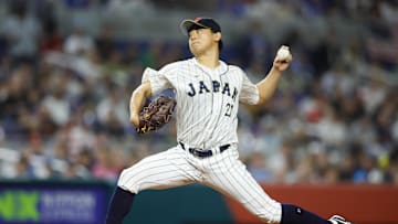 Mar 21, 2023; Miami, Florida, USA; Japan starting pitcher Shota Imanaga (21) delivers a pitch during