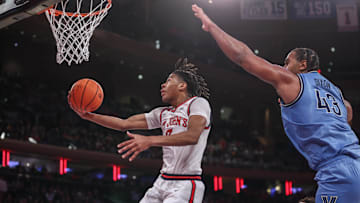 Jan 11, 2025; New York, New York, USA;  St. John's basketball guard Simeon Wilcher (7) drives to the basket against Villanova Wildcats forward Eric Dixon (43) in the second half at Madison Square Garden.