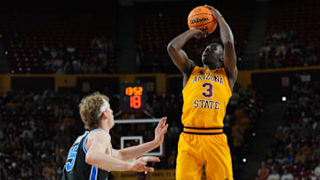 Feb 26, 2025; Tempe, Arizona, USA; St. John's basketball transfer guard Joson Sanon (3) shoots over Brigham Young Cougars forward Richie Saunders (15) during the second half at Desert Financial Arena.