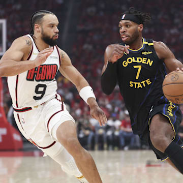 May 4, 2025; Houston, Texas, USA; Golden State Warriors guard Buddy Hield (7) dribbles the ball as Houston Rockets forward Dillon Brooks (9) defends during the first quarter of game seven of the first round for the 2025 NBA Playoffs at Toyota Center. Mandatory Credit: Troy Taormina-Imagn Images
