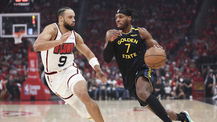 May 4, 2025; Houston, Texas, USA; Golden State Warriors guard Buddy Hield (7) dribbles the ball as Houston Rockets forward Dillon Brooks (9) defends during the first quarter of game seven of the first round for the 2025 NBA Playoffs at Toyota Center. Mandatory Credit: Troy Taormina-Imagn Images