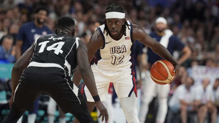 Jul 31, 2024; Villeneuve-d'Ascq, France; United States guard Jrue Holiday (12) dribbles against South Sudan shooting guard Peter Jok (14) in the fourth quarter during the Paris 2024 Olympic Summer Games at Stade Pierre-Mauroy. Mandatory Credit: John David Mercer-USA TODAY Sports