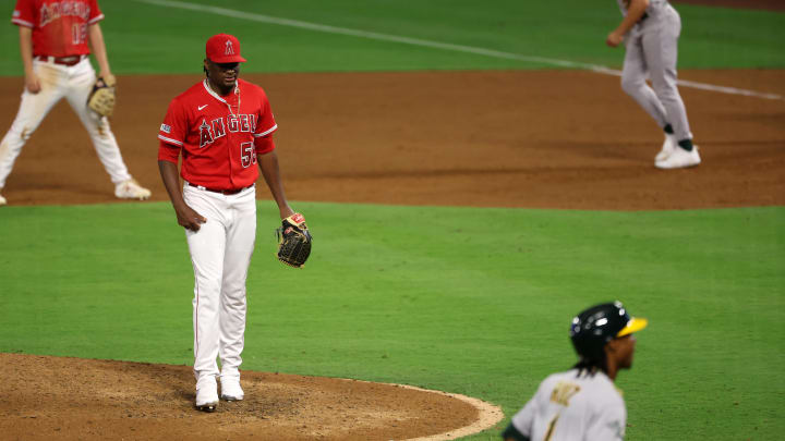 Sep 30, 2023; Anaheim, California, USA; Los Angeles Angels pitcher Jose Soriano (59) reacts after committing a balk with the bases loaded advancing Oakland Athletics center fielder Esteury Ruiz (1) and scoring the game tying run during the eighth inning at Angel Stadium. Mandatory Credit: Kiyoshi Mio-USA TODAY Sports