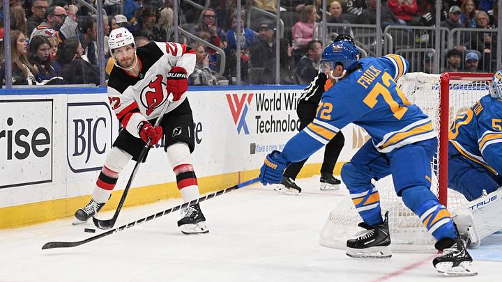 Feb 28, 2026; St. Louis, Missouri, USA; St. Louis Blues defenseman Justin Faulk (72) defends against New Jersey Devils defenseman Brett Pesce (22) in the third period at Enterprise Center. Mandatory Credit: Joe Puetz-Imagn Images