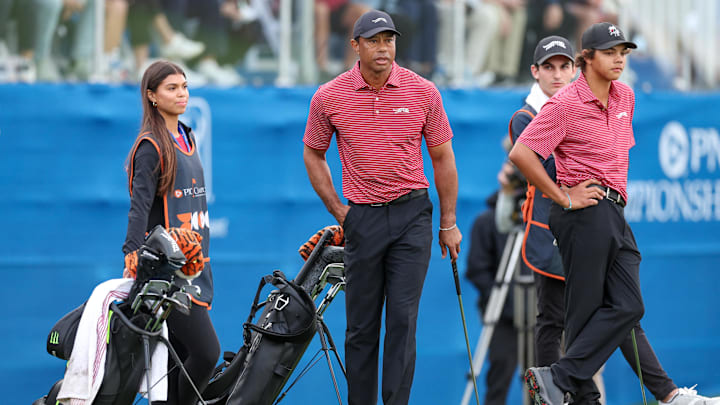 Dec 22, 2024; Orlando, Florida, [USA]; Tiger Woods son Charlie Woods and daughter Sam Woods look on during the PNC Championship at The Ritz-Carlton Golf Club. Mandatory Credit: Nathan Ray Seebeck-Imagn Images