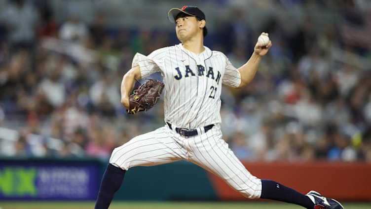 Mar 21, 2023; Miami, Florida, USA; Japan starting pitcher Shota Imanaga (21) delivers a pitch during