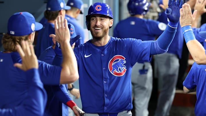 Sep 11, 2024; Los Angeles, California, USA;  Chicago Cubs right fielder Cody Bellinger (24) is greeted in the dugout after hitting a 3-run home run during the fifth inning against the Los Angeles Dodgers at Dodger Stadium. Mandatory Credit: Kiyoshi Mio-Imagn Images