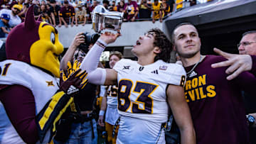 Nov 30, 2024; Tucson, Arizona, USA; Arizona State Sun Devils wide receiver Derek Eusebio (83) drinks out of the Territorial Cup at the end of the game against the Arizona Wildcats at Arizona Stadium. 