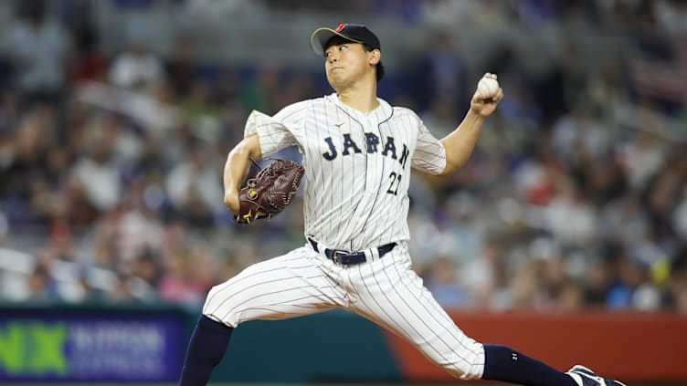 Mar 21, 2023; Miami, Florida, USA; Japan starting pitcher Shota Imanaga (21) delivers a pitch during