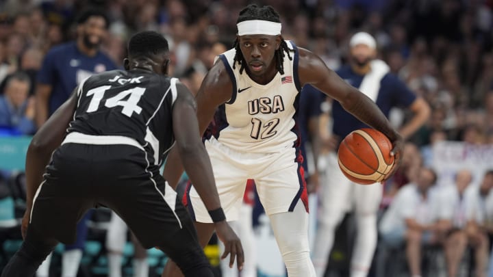 Jul 31, 2024; Villeneuve-d'Ascq, France; United States guard Jrue Holiday (12) dribbles against South Sudan shooting guard Peter Jok (14) in the fourth quarter during the Paris 2024 Olympic Summer Games at Stade Pierre-Mauroy. Mandatory Credit: John David Mercer-USA TODAY Sports