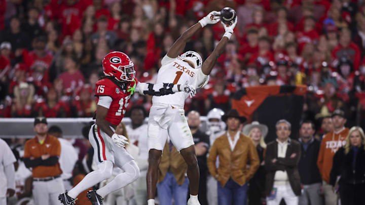 Nov 15, 2025; Athens, Georgia, USA; Texas Longhorns wide receiver Ryan Wingo (1) attempts to make a catch against Georgia Bulldogs defensive back Demello Jones (15) in the second half at Sanford Stadium. Mandatory Credit: Brett Davis-Imagn Images