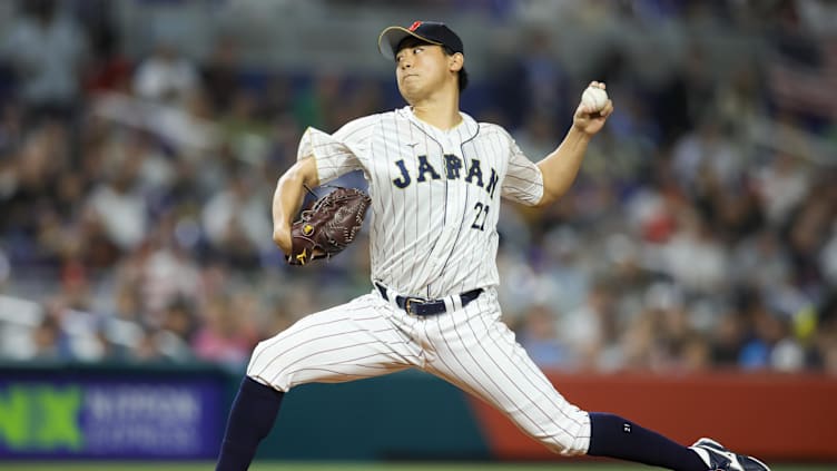 Mar 21, 2023; Miami, Florida, USA; Japan starting pitcher Shota Imanaga (21) delivers a pitch during