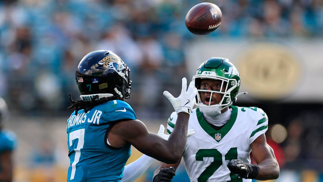 Jacksonville Jaguars wide receiver Brian Thomas Jr. (7) hauls in a reception against New York Jets cornerback Brandon Stephens (21) during the third quarter of a NFL football matchup at EverBank Stadium, Sunday, Dec. 14, 2025, in Jacksonville, Fla. The Jaguars defeated the Jets 48-20. [Corey Perrine/Florida Times-Union]