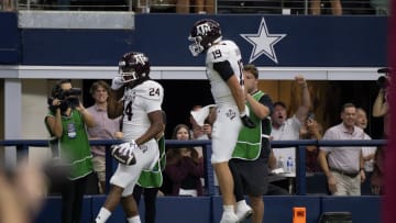 Sep 30, 2023; Arlington, Texas, USA; Texas A&M Aggies running back Earnest Crownover (24) and tight end Jake Johnson (19) celebrate after Crownover scores a touchdown against the Arkansas Razorbacks during the first half at AT&T Stadium. Mandatory Credit: Jerome Miron-USA TODAY Sports