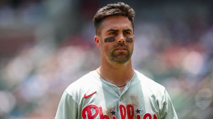 Jul 7, 2024; Atlanta, Georgia, USA; Philadelphia Phillies left fielder Whit Merrifield (9) after an inning against the Atlanta Braves in the second inning at Truist Park. Mandatory Credit: Brett Davis-USA TODAY Sports