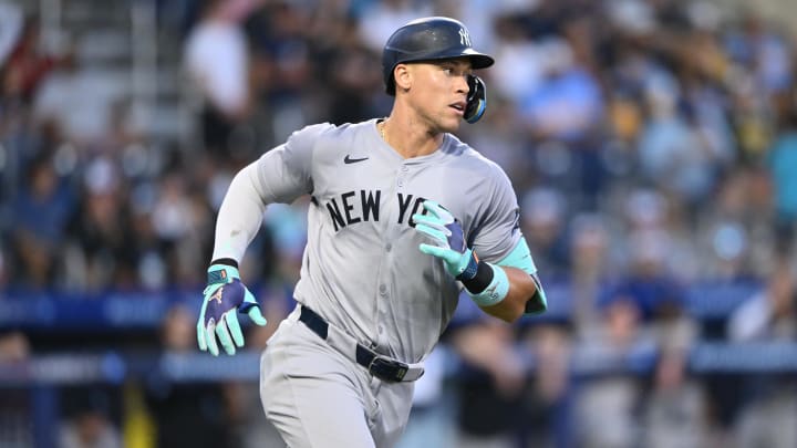 Aug 18, 2024; Williamsport, Pennsylvania, USA; New York Yankees outfielder Aaron Judge (99) runs to first after hitting a single against the Detroit Tigers in the fourth inning at BB&T Ballpark at Historic Bowman Field. Mandatory Credit: Kyle Ross-USA TODAY Sports