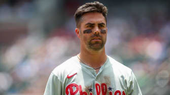 Jul 7, 2024; Atlanta, Georgia, USA; Philadelphia Phillies left fielder Whit Merrifield (9) after an inning against the Atlanta Braves in the second inning at Truist Park. 