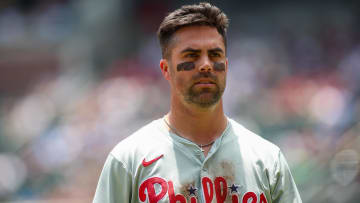 Jul 7, 2024; Atlanta, Georgia, USA; Philadelphia Phillies left fielder Whit Merrifield (9) after an inning against the Atlanta Braves in the second inning at Truist Park. Mandatory Credit: Brett Davis-USA TODAY Sports