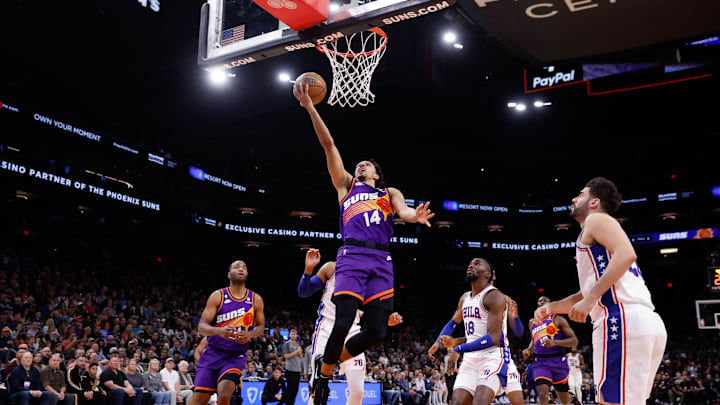 Mar 25, 2023; Phoenix, Arizona, USA; Phoenix Suns guard Landry Shamet (14) attempts a layup during the game against the Philadelphia 76ers at Footprint Center. Mandatory Credit: Chris Coduto-Imagn Images