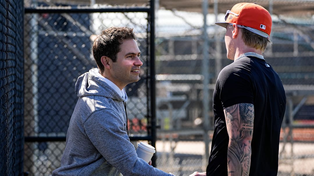 Detroit Tigers president of baseball operations Scott Harris, left, shakes hands with outfielder Max Clark at practice during spring training at TigerTown in Lakeland, Fla. on Friday, Feb. 13, 2026.