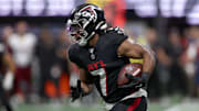 Atlanta Falcons running back Bijan Robinson (7) runs during the first half against the Washington Commanders at Mercedes-Benz Stadium. 