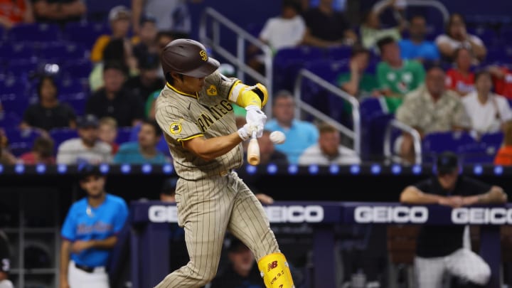 Aug 11, 2024; Miami, Florida, USA; San Diego Padres shortstop Ha-Seong Kim (7) hits a ground-rule double against the Miami Marlins during the ninth inning at loanDepot Park. Mandatory Credit: Sam Navarro-USA TODAY Sports