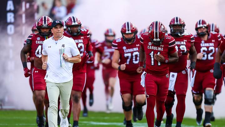 Nov 22, 2025; Columbia, South Carolina, USA; South Carolina Gamecocks head coach Shane Beamer leads his team onto the field before their game against the Coastal Carolina Chanticleers at Williams-Brice Stadium. Mandatory Credit: Jeff Blake-Imagn Images