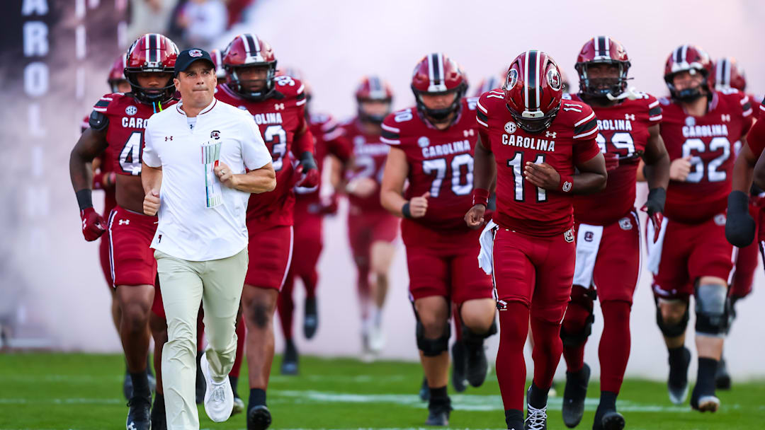 Nov 22, 2025; Columbia, South Carolina, USA; South Carolina Gamecocks head coach Shane Beamer leads his team onto the field before their game against the Coastal Carolina Chanticleers at Williams-Brice Stadium. Mandatory Credit: Jeff Blake-Imagn Images