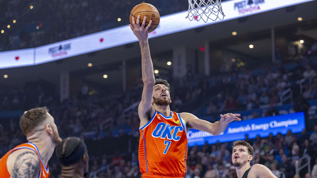 Nov 11, 2025; Oklahoma City, Oklahoma, USA; Oklahoma City Thunder center Chet Holmgren (7) goes to the basket against the Golden State Warriors during the first quarter at Paycom Center. Mandatory Credit: Alonzo Adams-Imagn Images