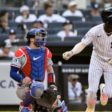 Aug 10, 2024; Bronx, New York, USA; New York Yankees third baseman Jazz Chisholm Jr. (13) hits a single against the Texas Rangers during the second inning at Yankee Stadium. Mandatory Credit: John Jones-USA TODAY Sports