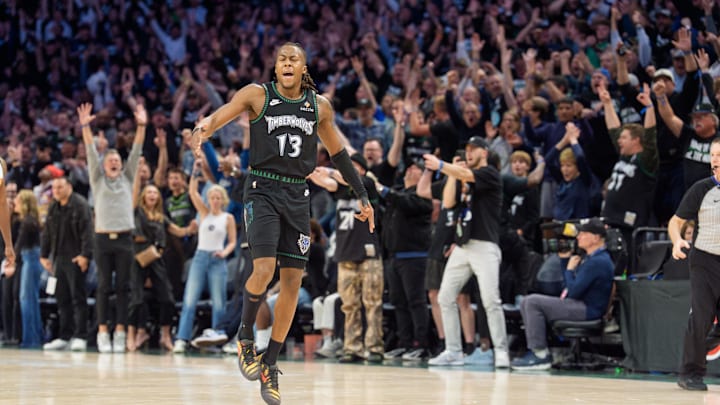 Apr 25, 2026; Minneapolis, Minnesota, USA; Minnesota Timberwolves guard Ayo Dosunmu (13) celebrates with fans after making a three-point shot against the Denver Nuggets in the fourth quarter at Target Center. Mandatory Credit: Matt Blewett-Imagn Images