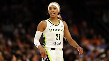 Jun 11, 2025; Phoenix, Arizona, USA; Dallas Wings guard DiJonai Carrington (21) against the Phoenix Mercury at PHX Arena. Mandatory Credit: Mark J. Rebilas-Imagn Images