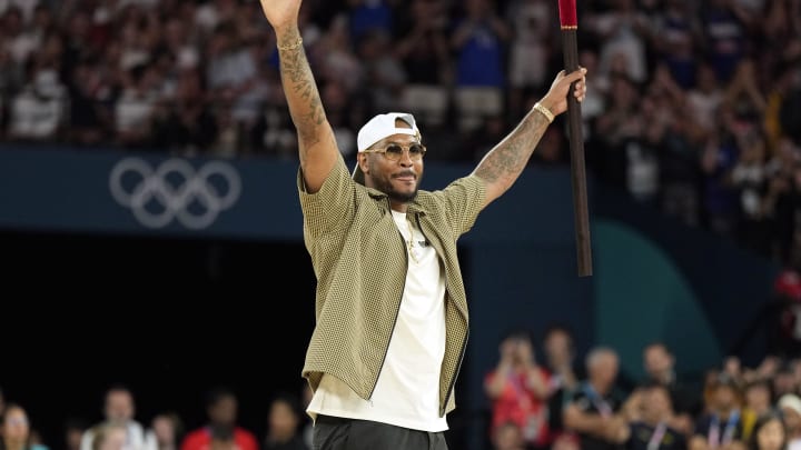 Aug 6, 2024; Paris, France; Carmelo Anthony performs before a men’s basketball quarterfinal game between the United States and Brazil during the Paris 2024 Olympic Summer Games at Accor Arena. Mandatory Credit: Kyle Terada-USA TODAY Sports