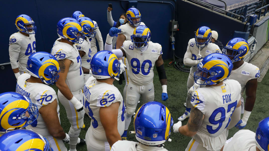 Dec 27, 2020; Seattle, Washington, USA; Los Angeles Rams defensive end Michael Brockers (90) huddles with teammates before pregame warmups prior to the game against the Seattle Seahawks at Lumen Field. Mandatory Credit: Joe Nicholson-USA TODAY Sports