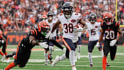 Nov 2, 2025; Cincinnati, Ohio, USA; Chicago Bears running back Brittain Brown (38) runs for a touchdown against Cincinnati Bengals safety Jordan Battle (27) and cornerback DJ Turner II (20) during the third quarter at Paycor Stadium. Mandatory Credit: Joseph Maiorana-Imagn Images
