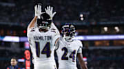 Oct 30, 2025; Miami Gardens, Florida, USA;  Baltimore Ravens safety Kyle Hamilton (14) and safety Malaki Starks (24) react after a play during the second quarter against the Miami Dolphins at Hard Rock Stadium. Mandatory Credit: Nathan Ray Seebeck-Imagn Images