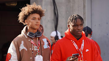 Recruits Dia Bell and Byron Louis watch Ohio State warm up before playing Penn State Oct. 21, 2023 at Ohio Stadium.