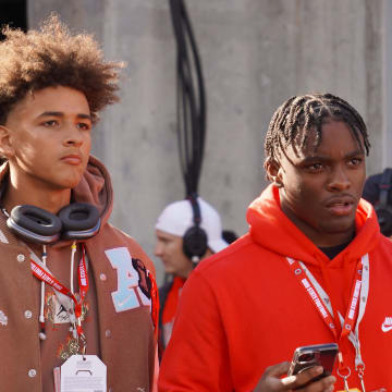 Recruits Dia Bell and Byron Louis watch Ohio State warm up before playing Penn State Oct. 21, 2023 at Ohio Stadium.