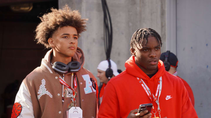 Recruits Dia Bell and Byron Louis watch Ohio State warm up before playing Penn State Oct. 21, 2023 at Ohio Stadium.