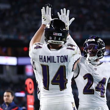 Oct 30, 2025; Miami Gardens, Florida, USA; Baltimore Ravens safety Kyle Hamilton (14) and safety Malaki Starks (24) react after a play during the second quarter against the Miami Dolphins at Hard Rock Stadium. Mandatory Credit: Nathan Ray Seebeck-Imagn Images