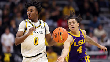 Missouri Tigers guard Anthony Robinson II (0) facilitates the court in a game against the LSU Tigers this season.