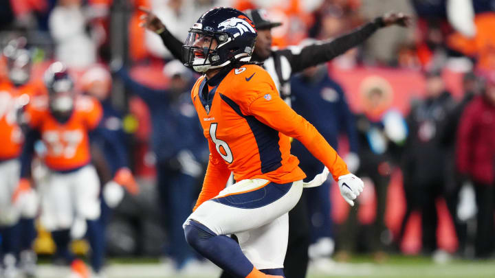 Nov 26, 2023; Denver, Colorado, USA; Denver Broncos safety P.J. Locke (6) celebrates his sack against the Cleveland Browns in the fourth quarter at Empower Field at Mile High. Mandatory Credit: Ron Chenoy-USA TODAY Sports